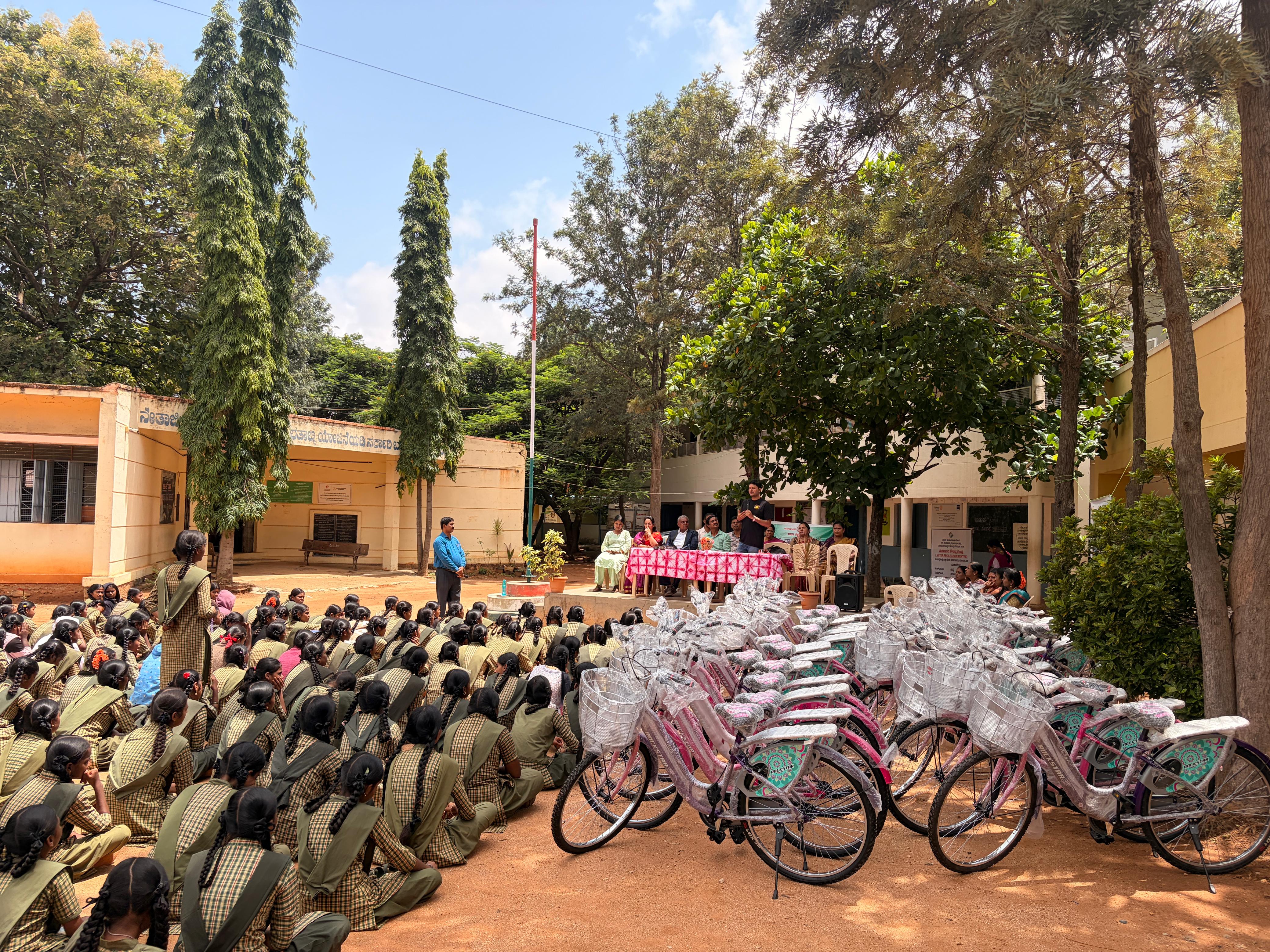 Girls seated with their new bicycles at the Hope Givers Bicycle Donation Drive