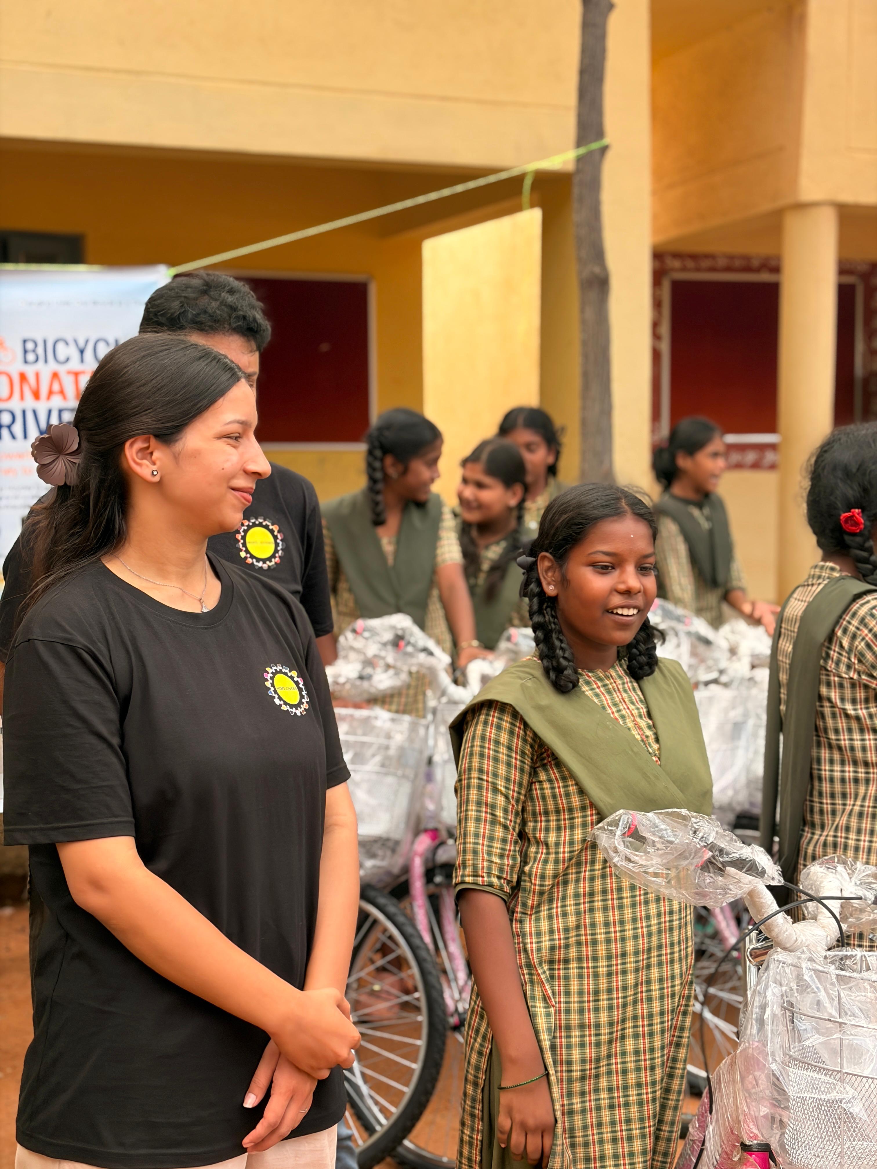A student receives her new bicycle at the donation drive